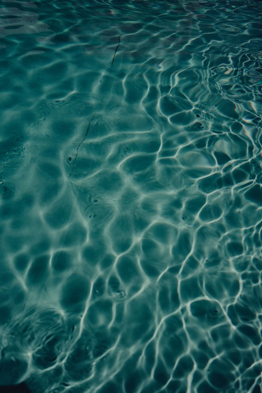water in a pool of some sort with the ripples off of water