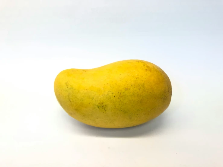 a large yellow vegetable with a white background