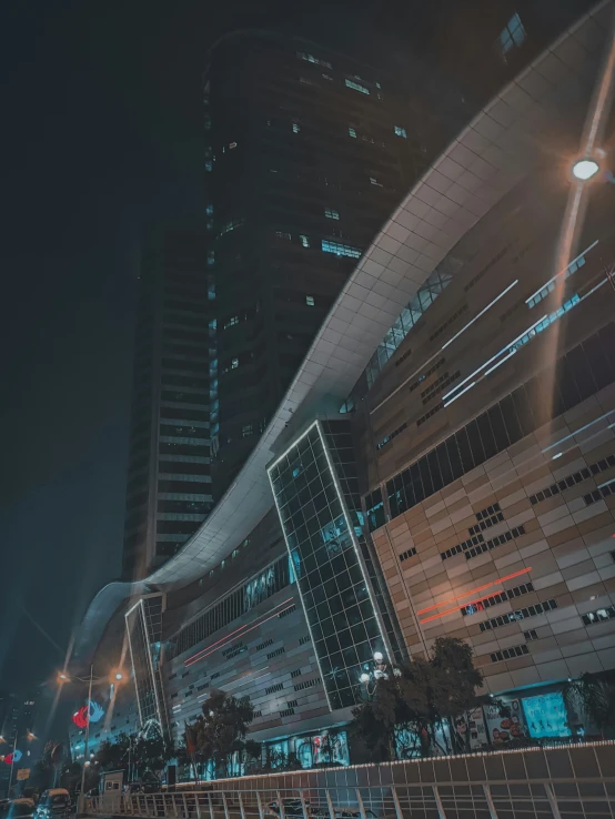 a street lined with tall buildings at night