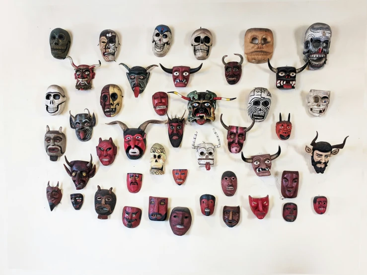 an assortment of masks made to look like people's faces