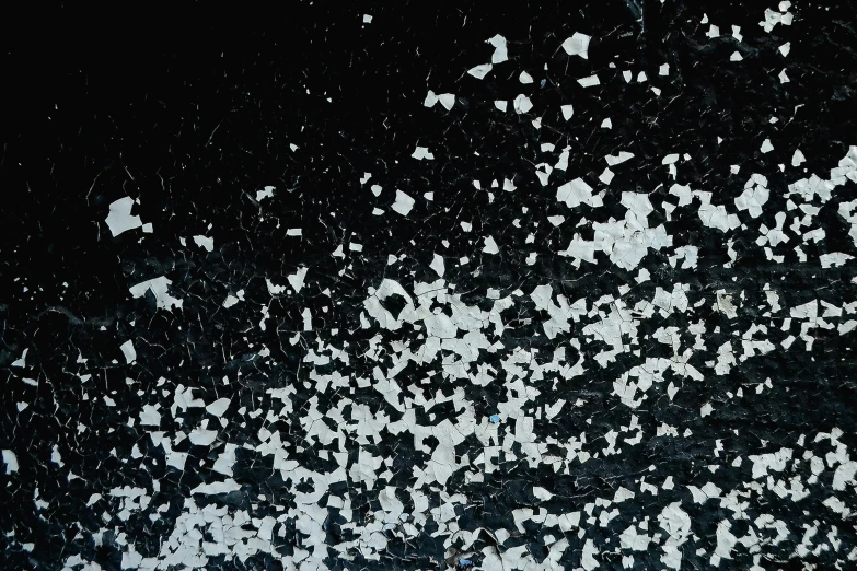 a white ink splattered in black background