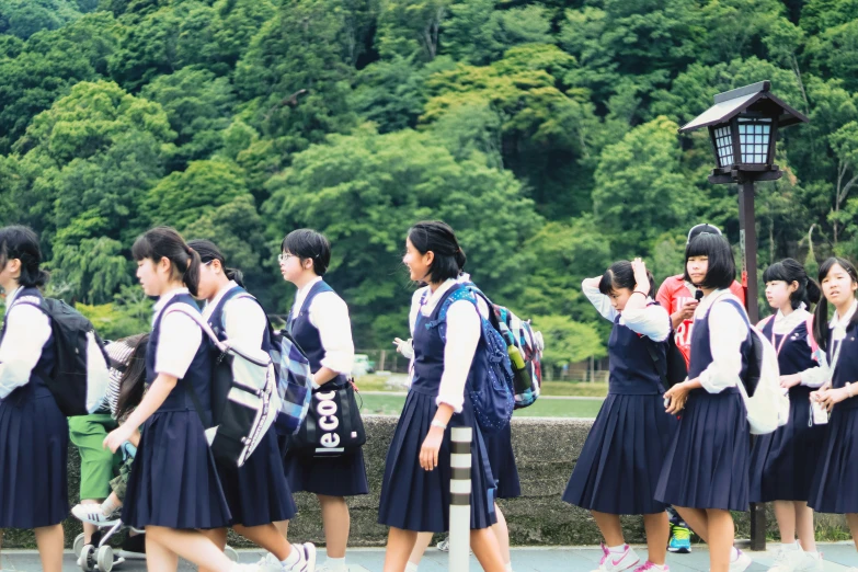 students from the asian school are walking together