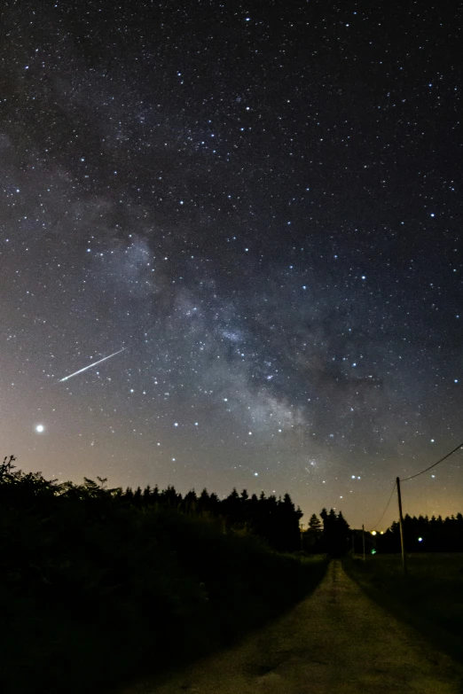 the stars are lit up above the street at night