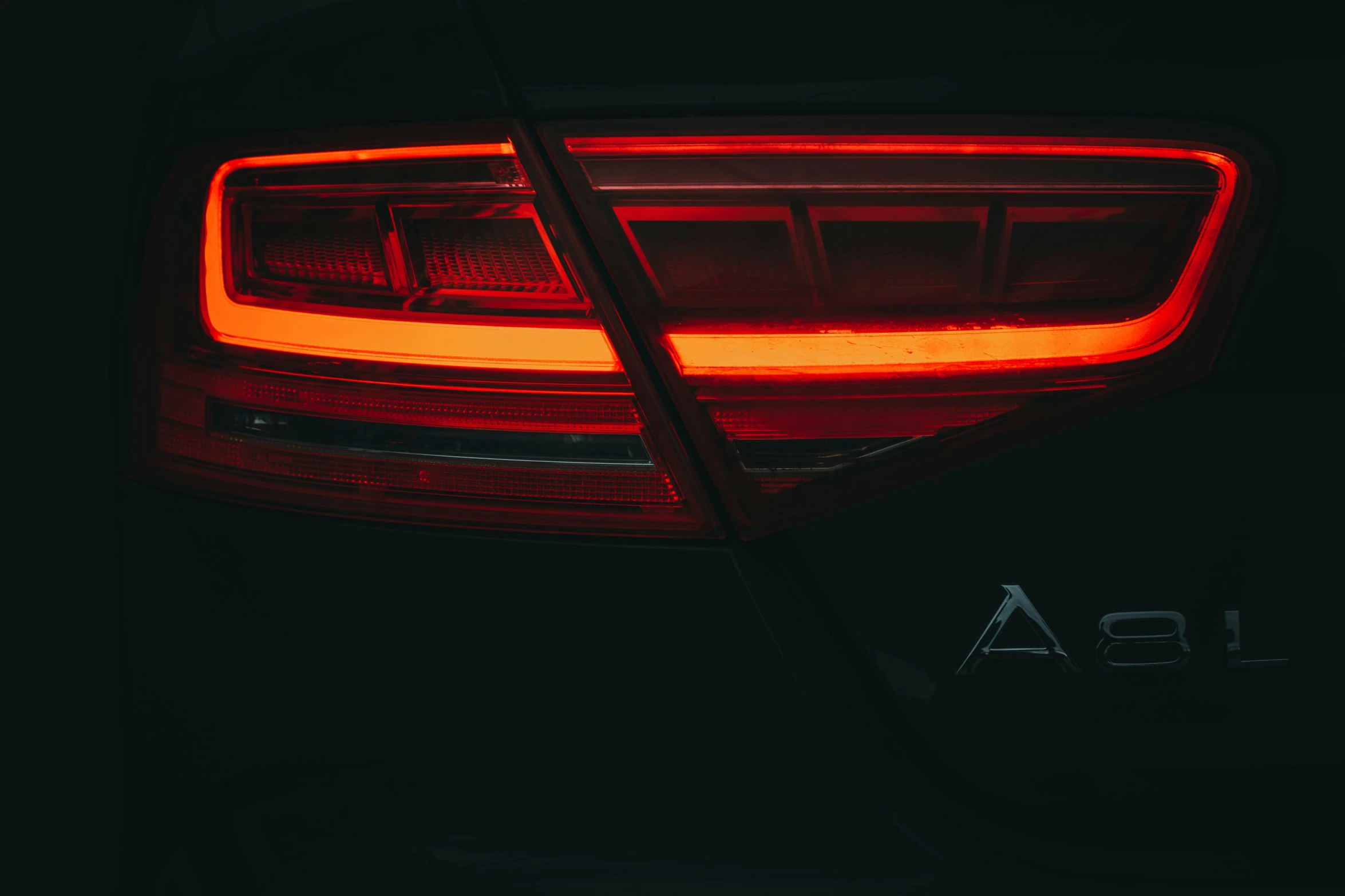 the taillight of an automobile car that has been turned red
