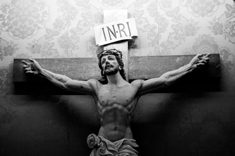 jesus is crucifix with an inverted cross in the center