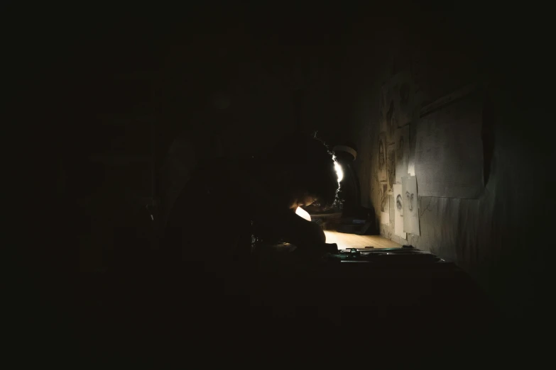 a man working with an oven at night