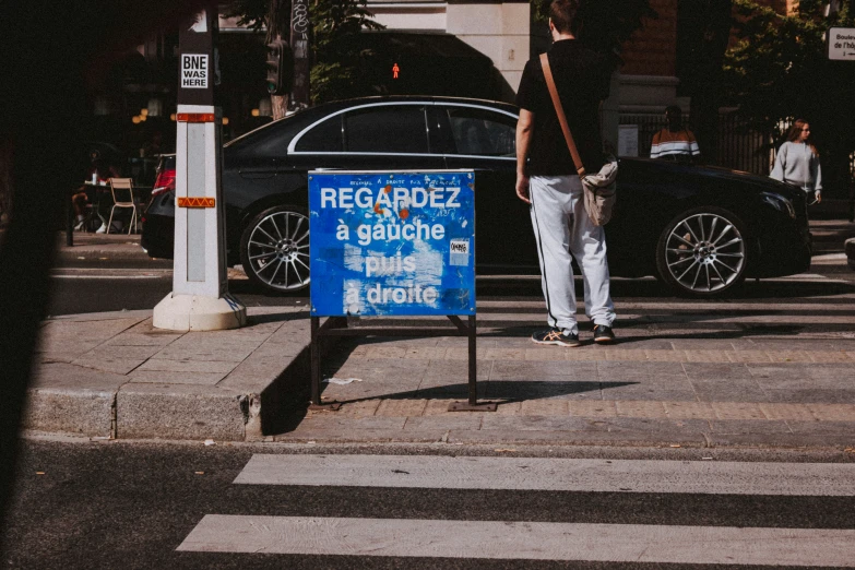 a man crossing the street at a cross walk