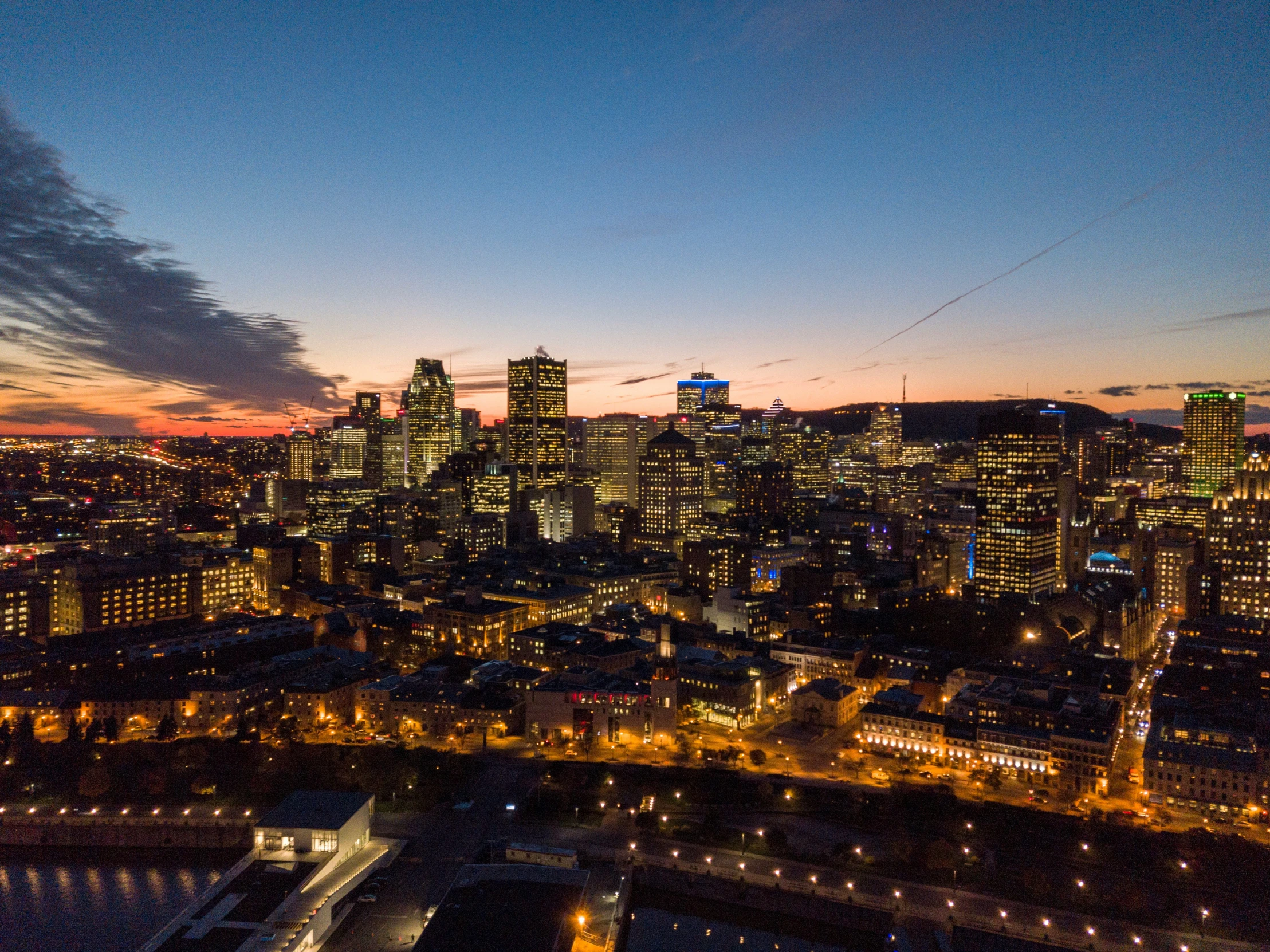 a night view of some very tall buildings