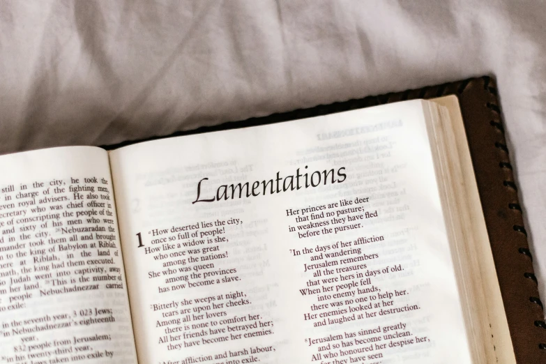 an open bible with three words displayed