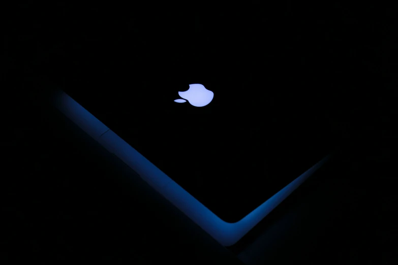an image of a very dark background with apple logo