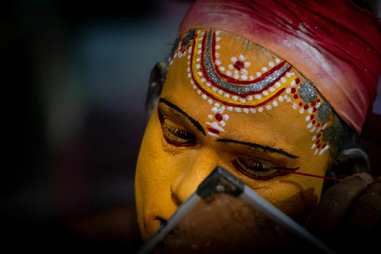 a close up s of a colorful face painting