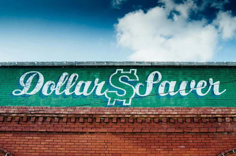 the word dollar save written on a wall