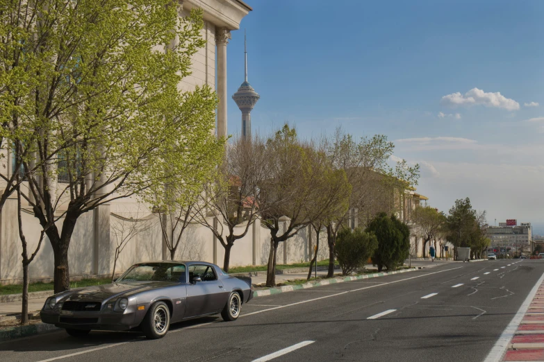 a street that has a car parked on the side