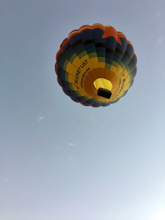 this  air balloon looks like it is flying high in the sky