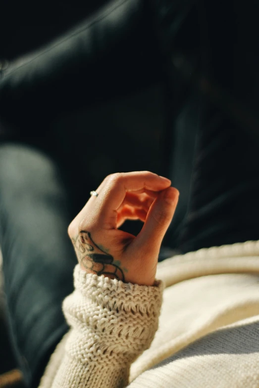 a woman is holding soing in her hands