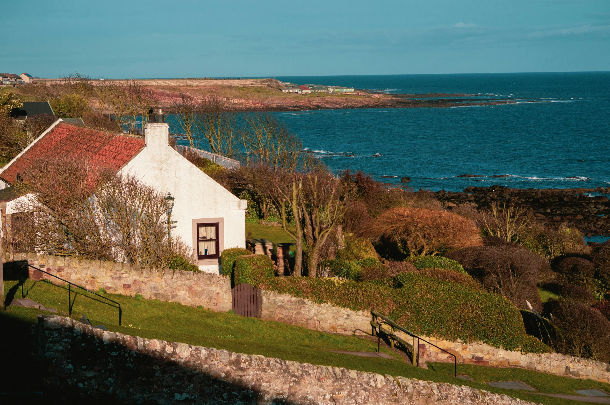 a house on the hill near the sea