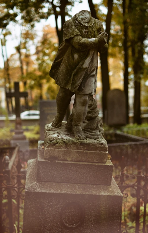 a statue of a little girl standing on one leg