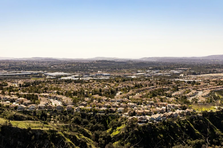 the view over a mountain town from high up on a hill