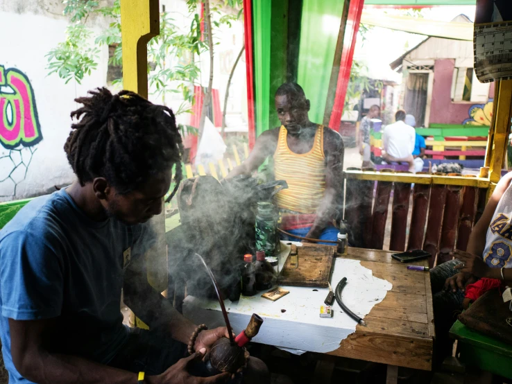 a group of people working on a piece of artwork