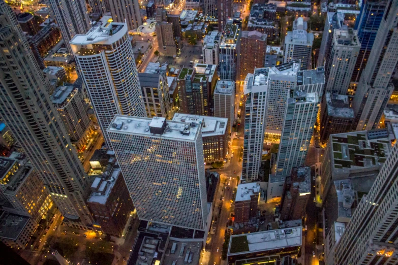 an aerial view of a city with tall buildings