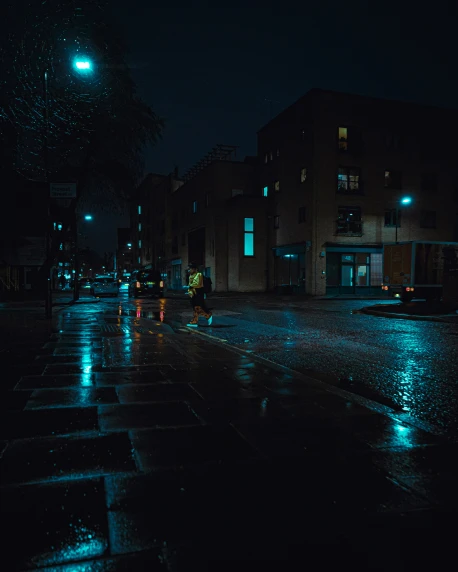 people walk in the dark at night in the rain