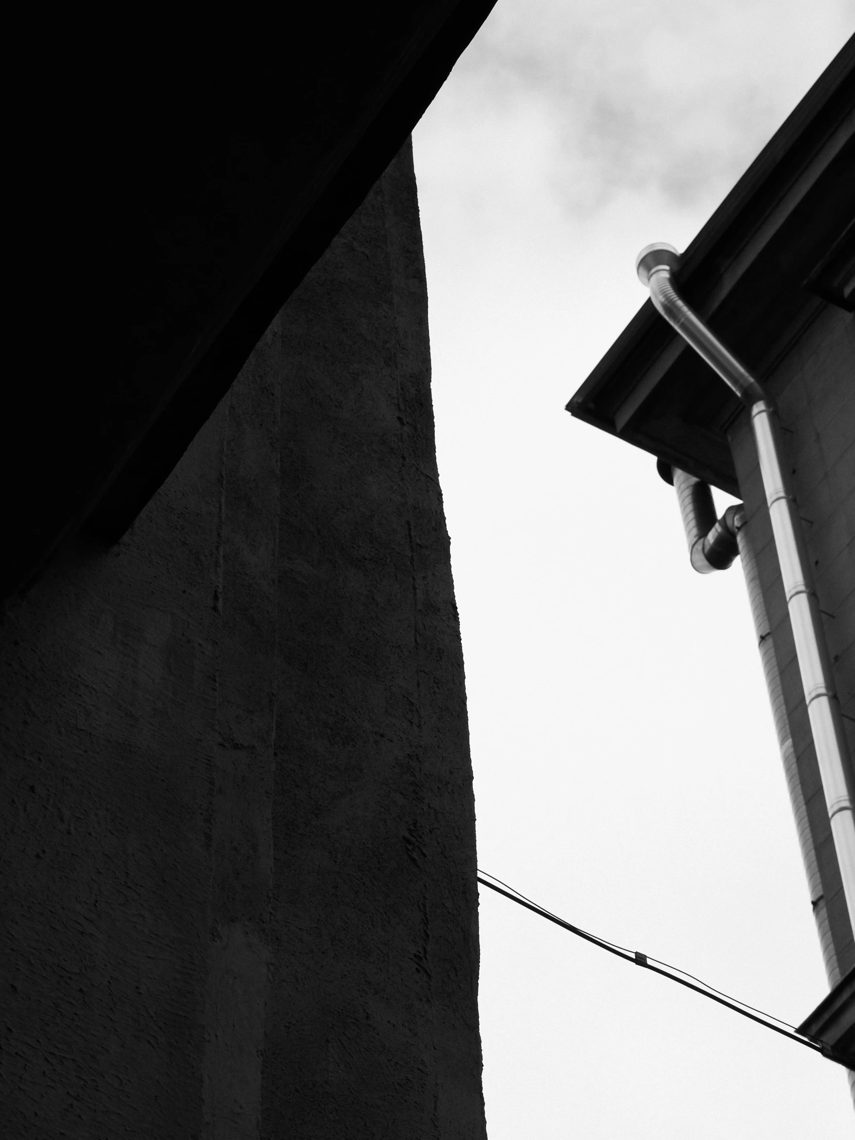 a tall gray building near a street light