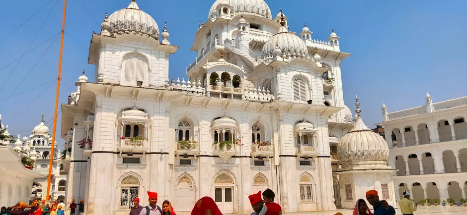 a group of people standing in front of a building