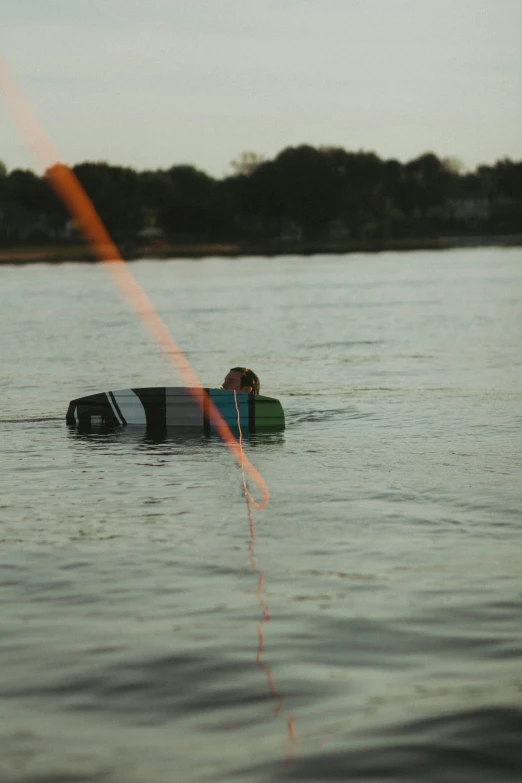 a person on a surfboard riding in the water