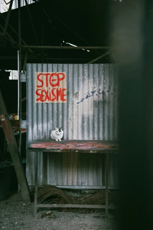 a shelf next to a wall with writing on it