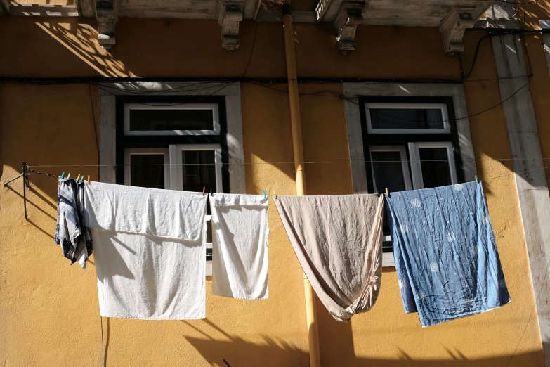 the clothes are drying on the line outside