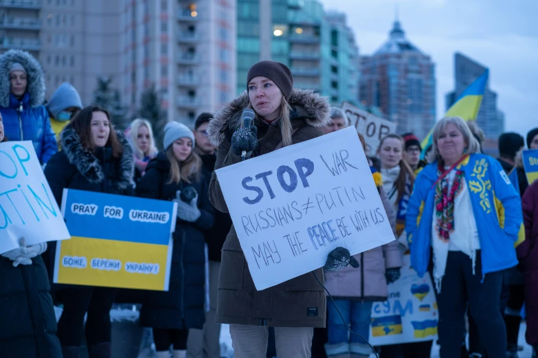 people are holding signs that say stop, the word is too short for them