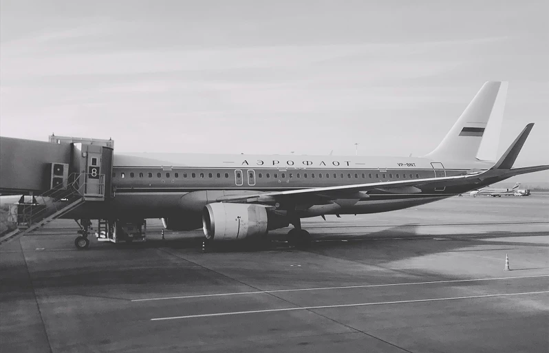 a large jetliner sitting on top of an airport tarmac