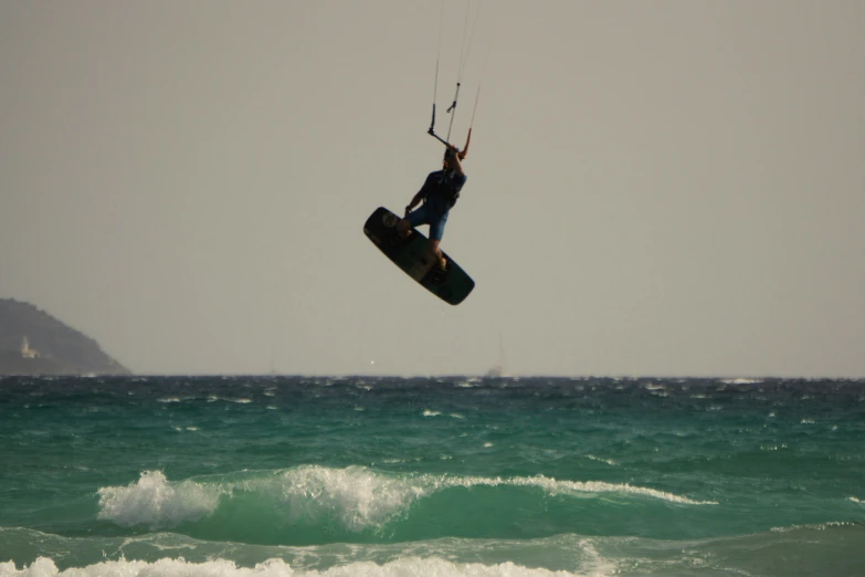 a man in the air with a para sail