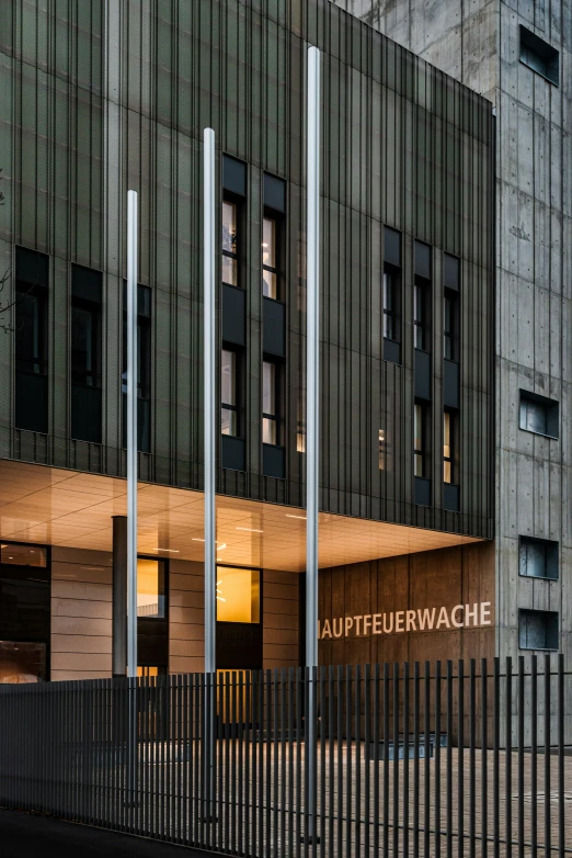 a large building with glass front doors is lit up