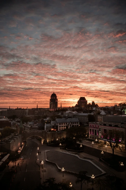 a city at dusk with red and orange colors