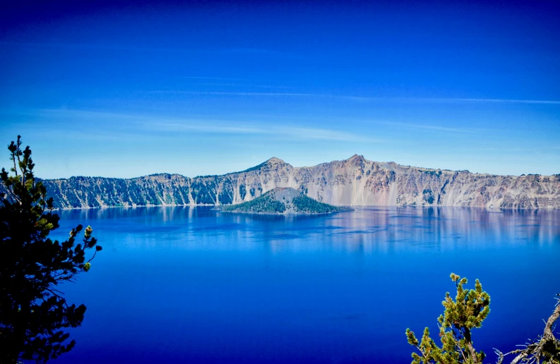 a picture taken from a high viewpoint looking at a blue lake