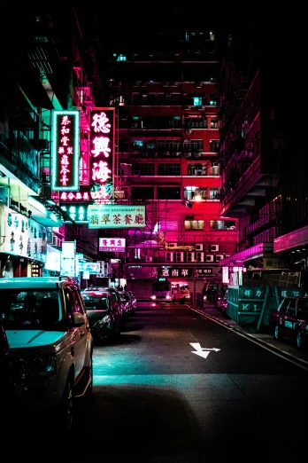a dark alley filled with neon signs and cars