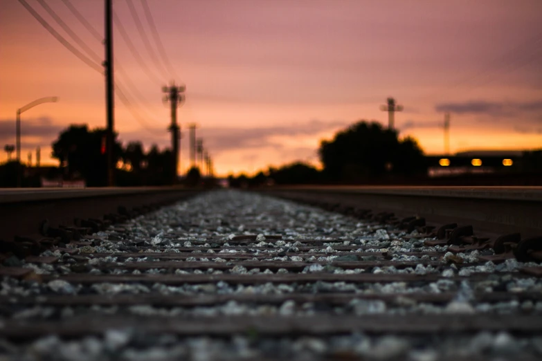 view down a train track at sunset from the top