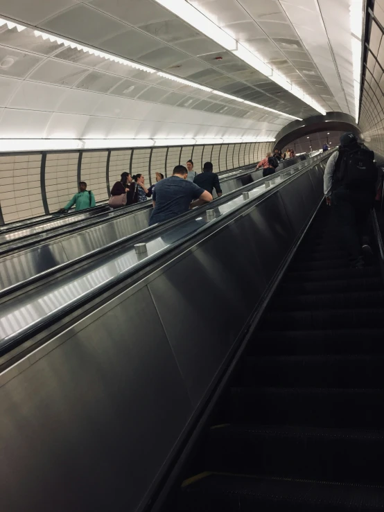 the people are on the escalator