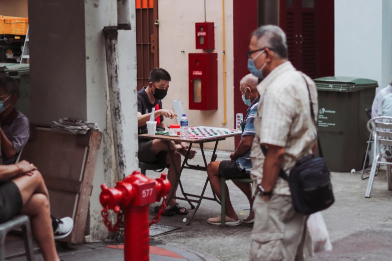 four people are playing game on the street