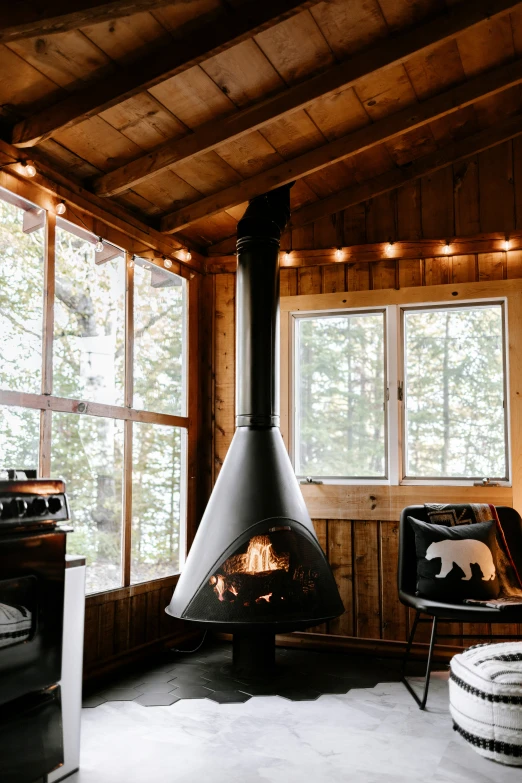 a small wood stove in a cozy cabin