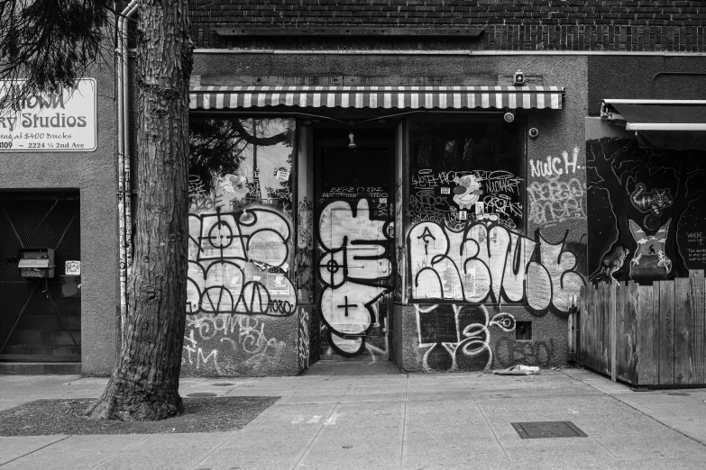 a bunch of graffiti is shown on the side of a building