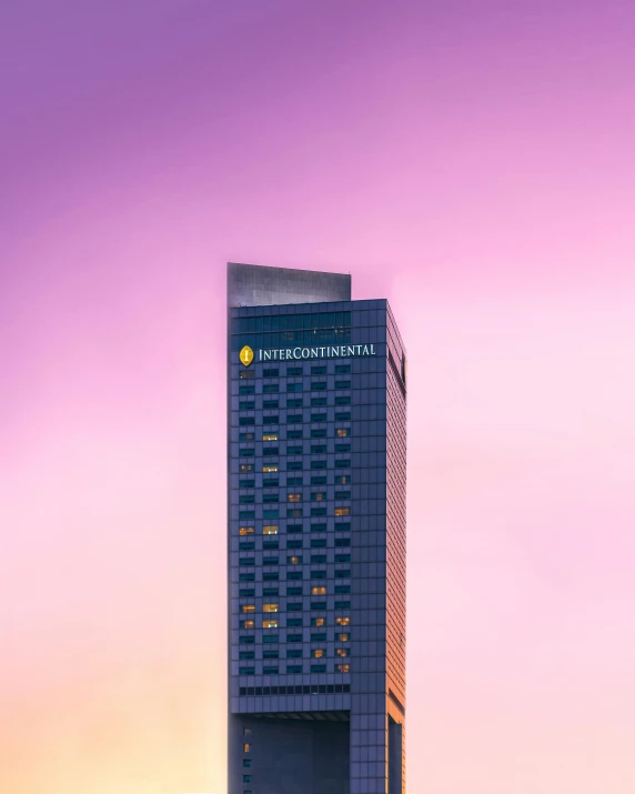 the tall building has a clock on its tower