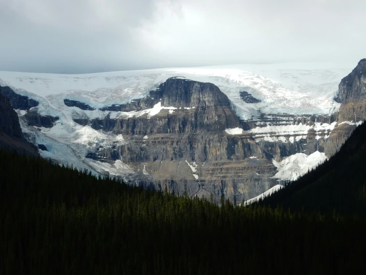 an image of mountains with some snow on them