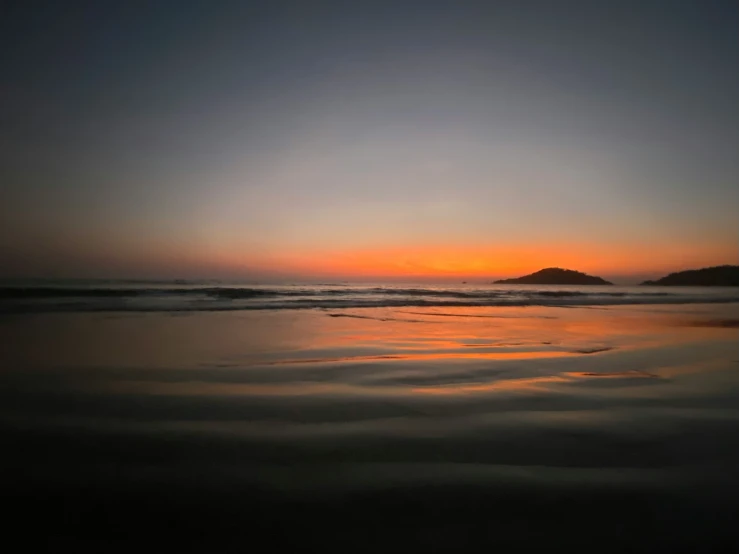 a beach that has some very pretty reflections in it