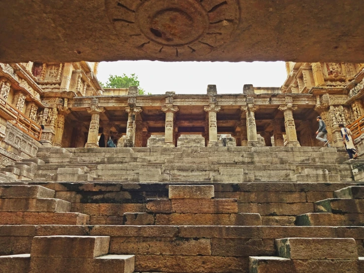 some steps are in front of some stone buildings