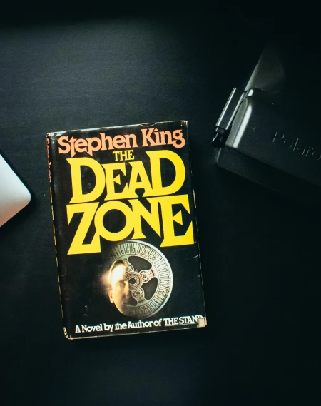 this is a paperback book cover with an image of the dead zone