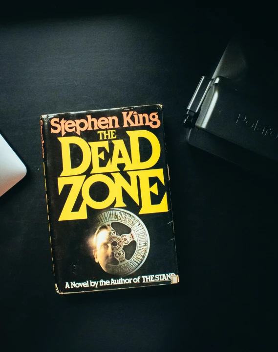 this is a paperback book cover with an image of the dead zone