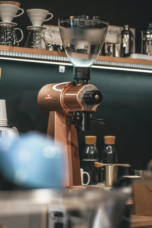 an espresso maker is sitting on a counter