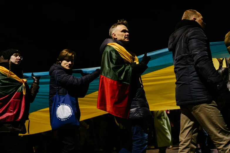 a bunch of people who are holding their flags